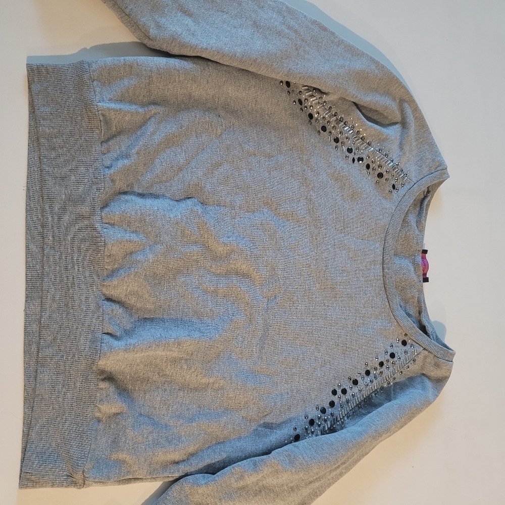 Mark. Grey sweater